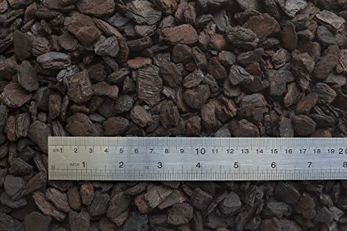 Orchiata - Close-up of larger dark brown orchid bark chunks measured against a ruler showing centimeter and inch markings